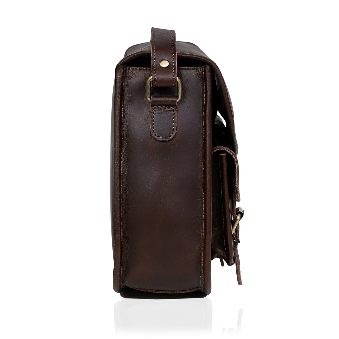 Brown leather bag with a strap on a white background