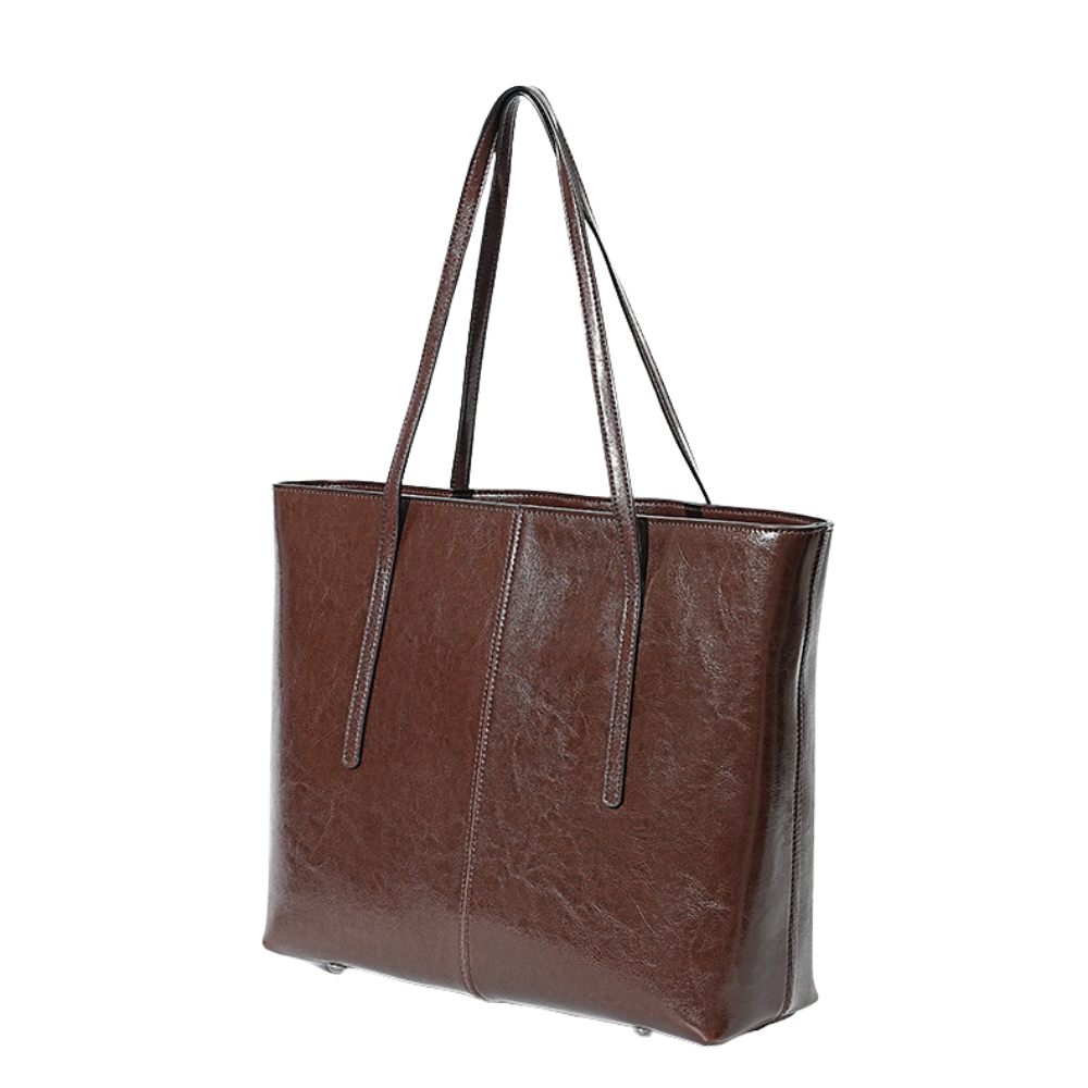 Brown leather tote bag on a white background