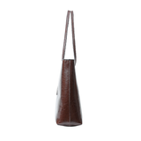 A dark brown leather tote bag shown from the side profile against a plain white background.