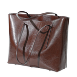 Brown leather tote bag on a white background