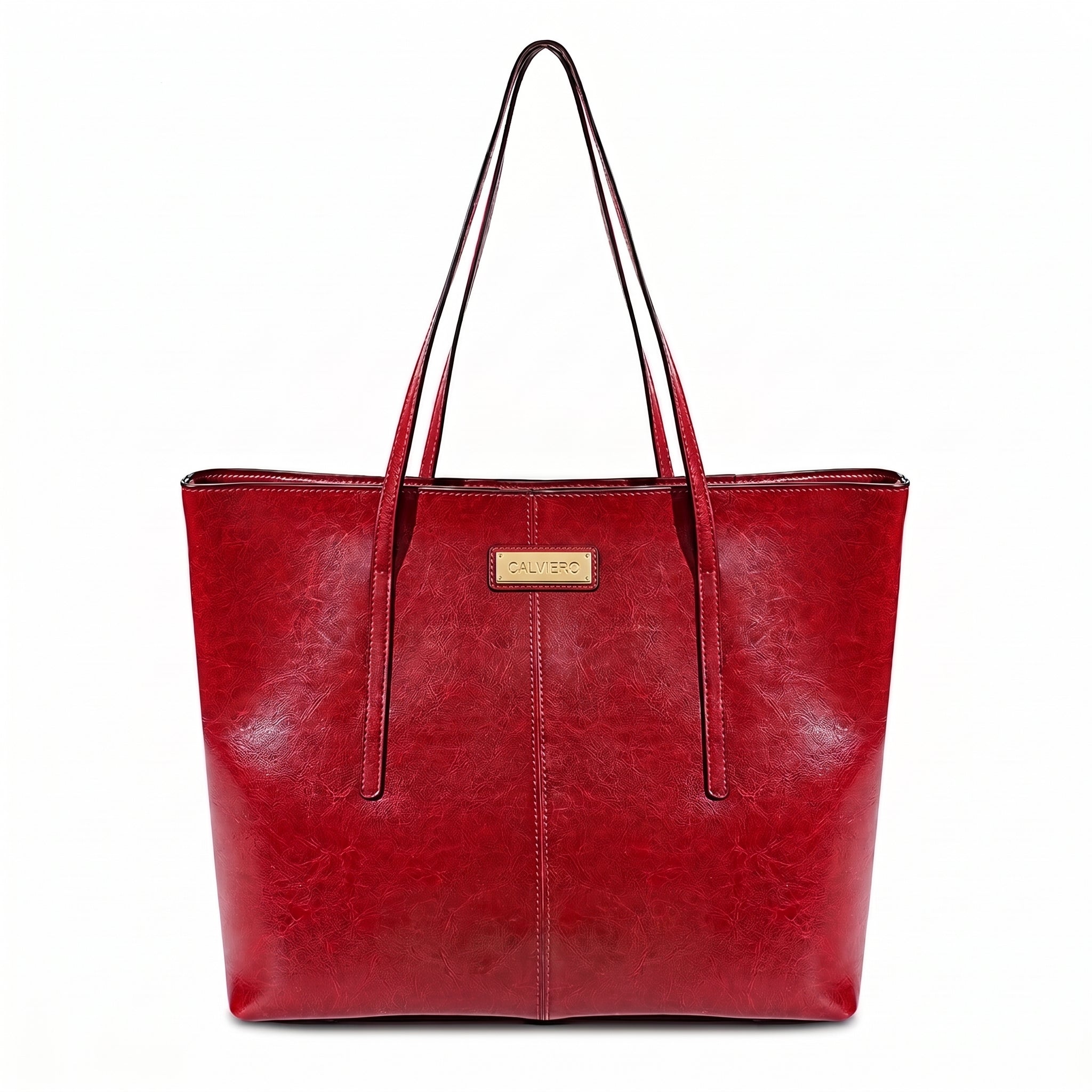 A red faux-leather tote bag with dual shoulder straps and a small gold-tone metal brand plaque on the front, shown against a plain white background.