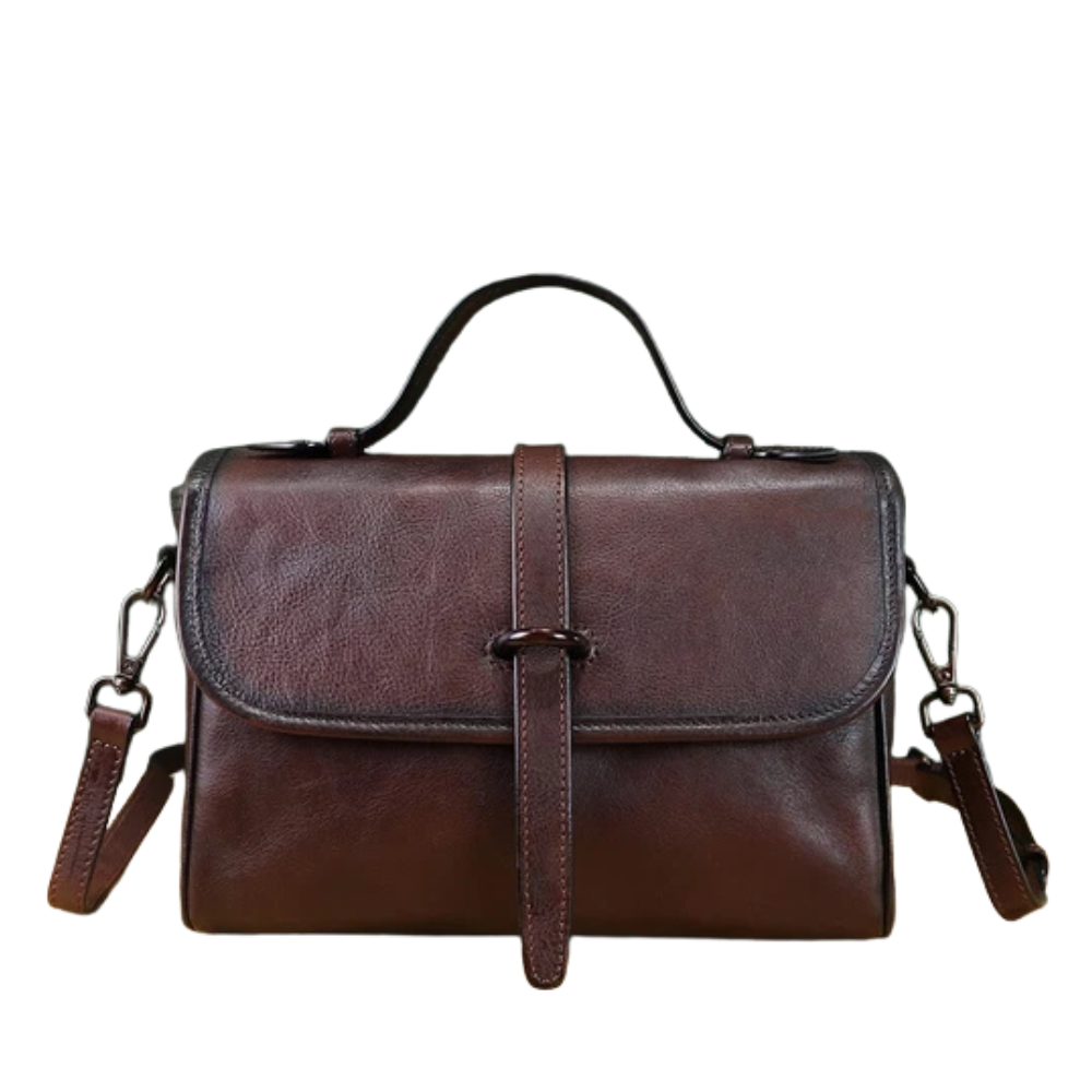 Brown leather handbag with a strap on a white background