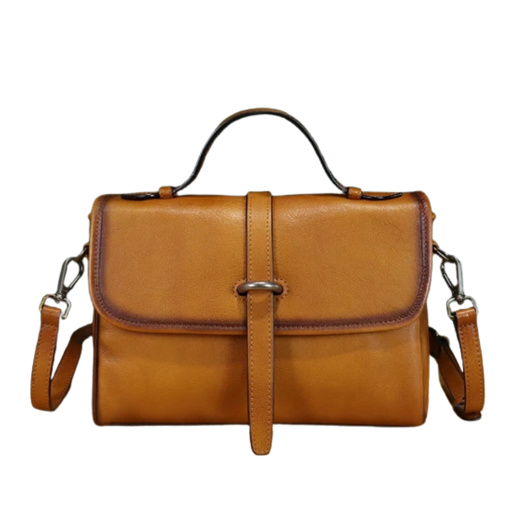 Brown leather handbag with a strap on a white background