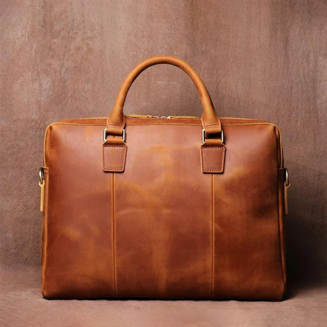 Brown leather briefcase on a brown background