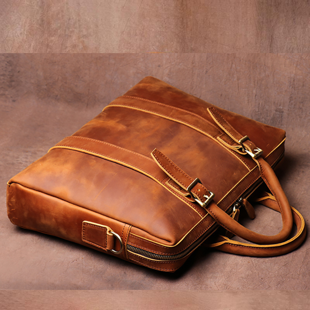 Brown leather briefcase on a brown background