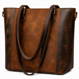 Brown leather tote bag on a white background